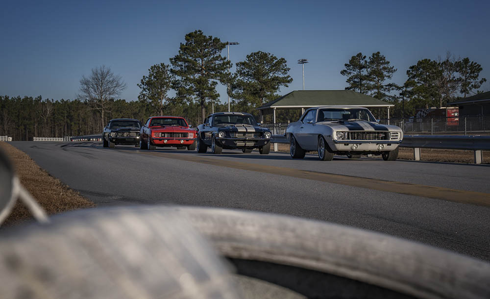 A group of cars parked on the side of a road.